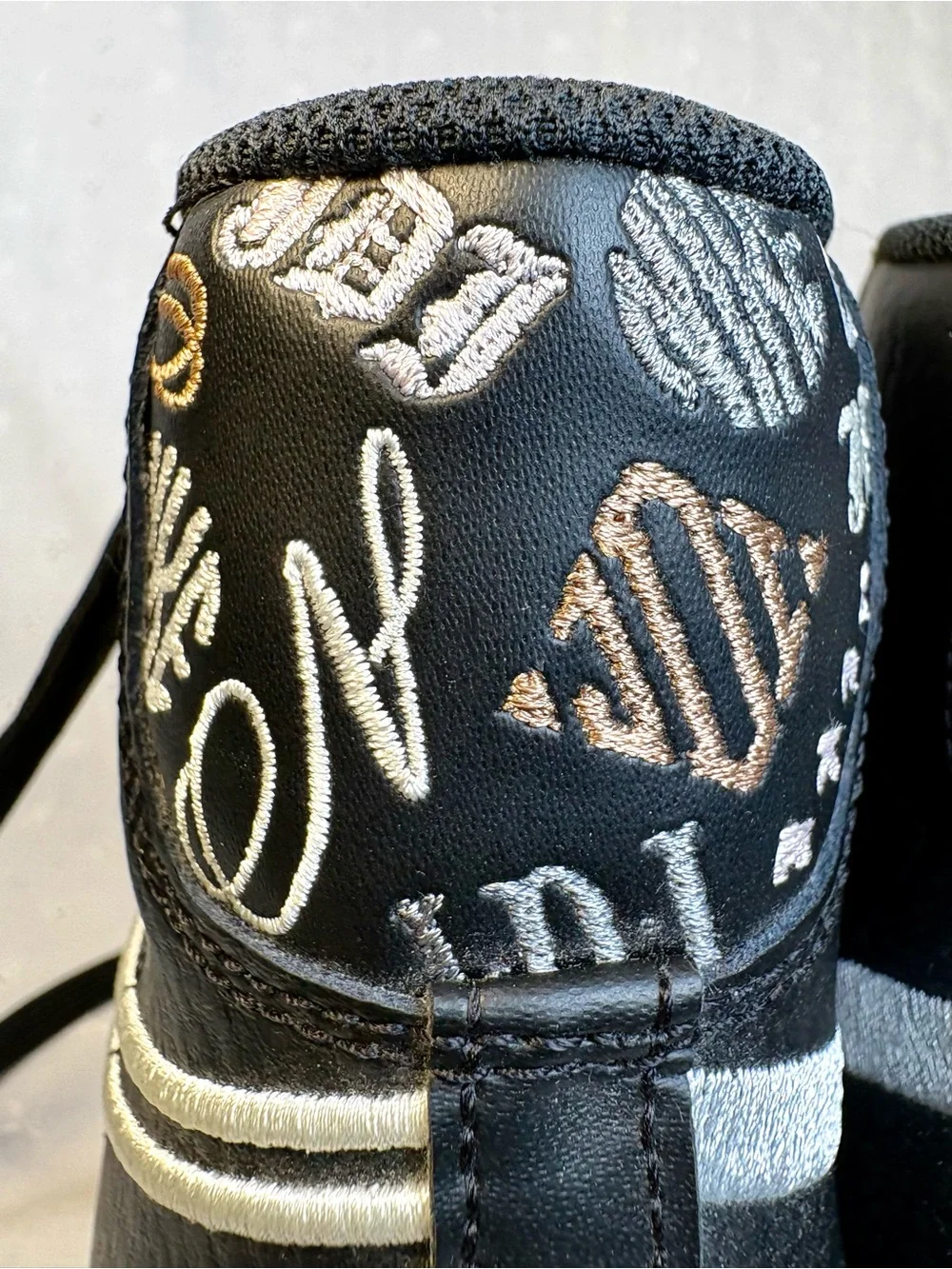 Nike Black High-Top Sneakers with White Tongue Text